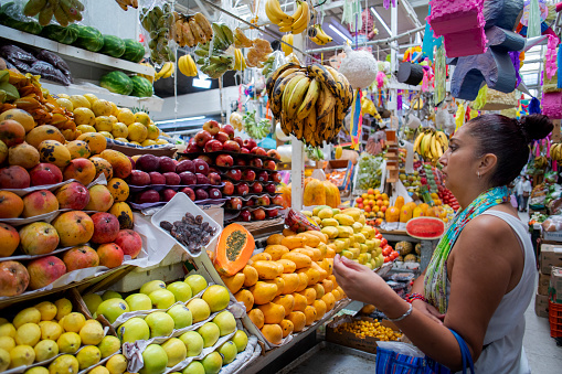 bananas with grapes and plums at the market