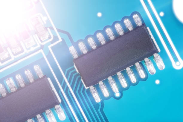 istock Closeup of a blue computer circuit board, Microchip 1415703418