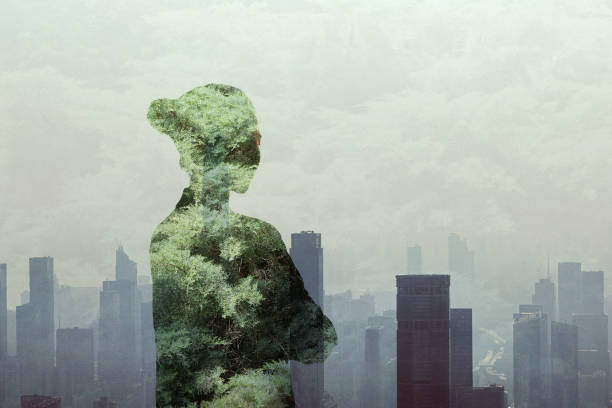 Young Chinese adult woman person standing with ideas in contemplation and absence in smog urban city reflection with nature trees, multi-layered effect, in silhouette, shadow, rear view, waist up, composite image, women stock photo