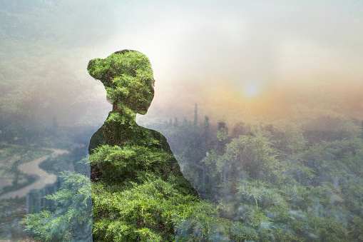 Person standing in contemplation in urban city with nature trees composite, Shenzhen, China