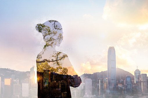 Chinese adult woman person standing with ideas in shadow contemplation mindfulness in urban Hong Kong city reflection with nature trees, waist up, rear view, behind, multi-layered effect, composite image,