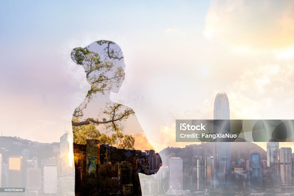 Chinese adult woman person standing with ideas in shadow contemplation mindfulness in urban Hong Kong city reflection with nature trees, waist up, rear view, behind, multi-layered effect, composite image, Person standing in contemplation in urban Hong Kong city reflection with nature trees Change Stock Photo