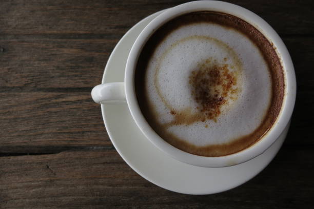 istock A cup of coffee on wood table 1415704343