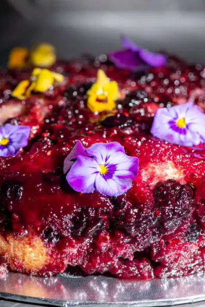 Home-made upside-down cake with mixed berries including organic strawberries, blueberries, blackberries, and raspberries.