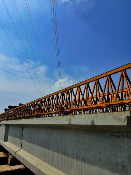 istock Several girders are arranged below yellow launcher gantry 1415708182