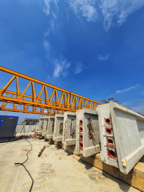 istock Several girders are arranged below yellow launcher gantry 1415708207
