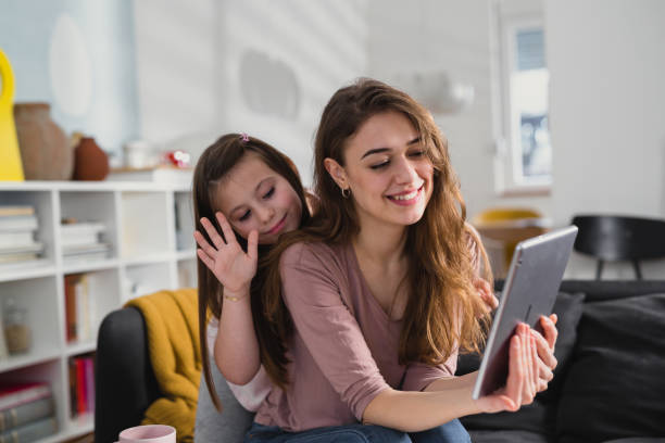istock mother and daughter at home 1415717374