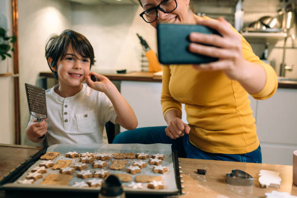 istock mother and son makes cookies in kitchen 1415718153