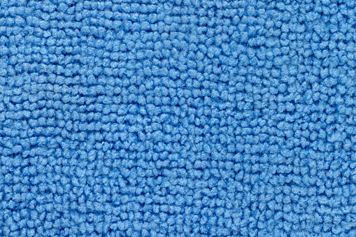 Background, photo of a blue synthetic coating texture, close-up.