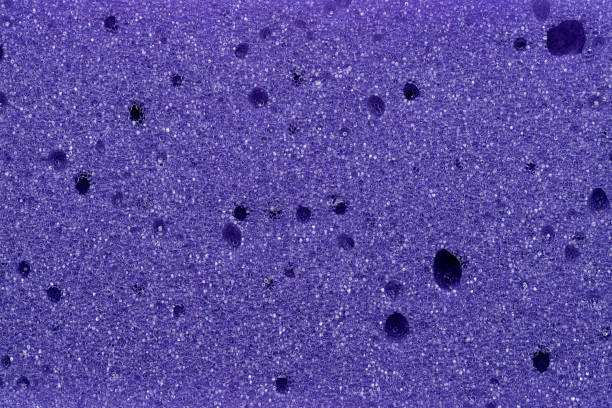 istock Background, photo texture from purple foam rubber, close-up. 1415718279