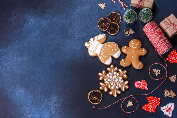 istock Christmas homemade gingerbread cookies on dark concrete table 1415720935