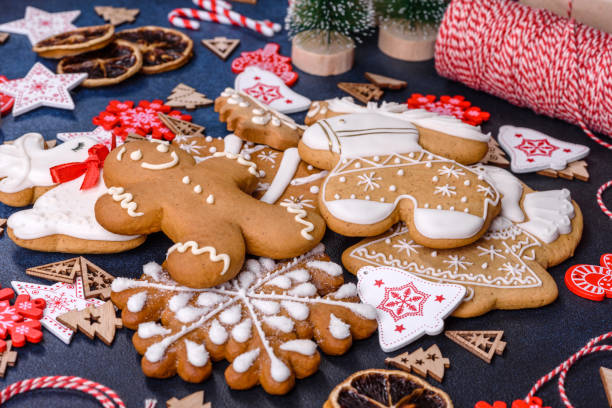 istock Christmas homemade gingerbread cookies on dark concrete table 1415720951