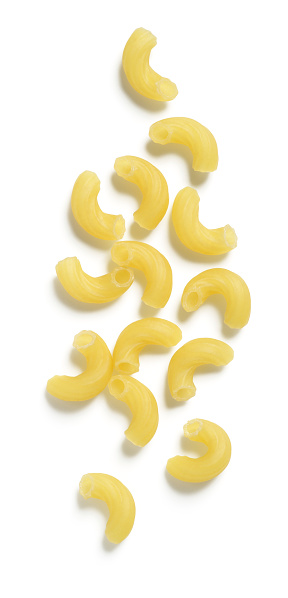 Dry macaroni (or elbow) pasta isolated on 255 white.