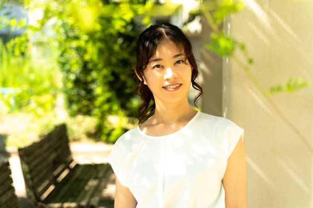 istock young woman in the park 1415724437
