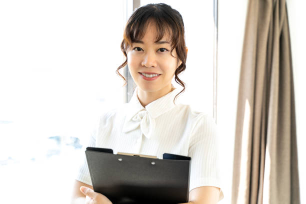 istock woman with files 1415724636