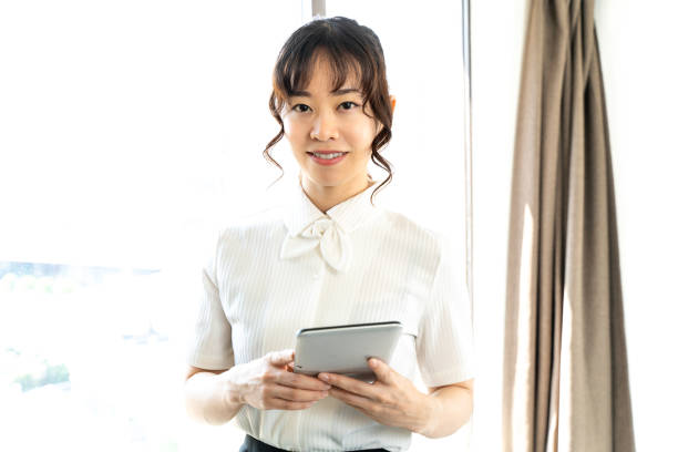 istock woman looking at tablet 1415724715