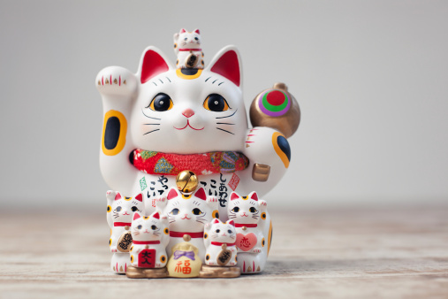 Maneki Neko cat. Common Japanese sculpture bring good luck to the owner.