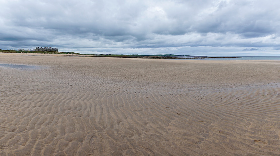 panorama landscape of Doughmore Bay and Beach with the Trump International Golf Club hotel in the background
