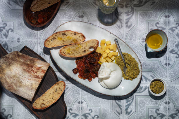 istock italian  cheese on a plate with pesto bread and tomatos 1415726685