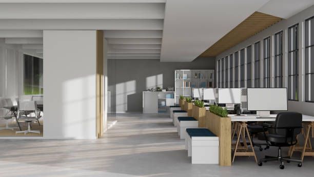 istock Front view of a Modern contemporary office interior with a rows of computer desks 1415728278