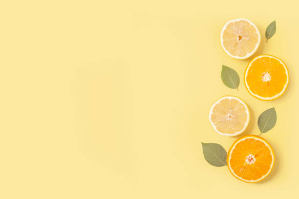 istock Delicate yellow background with fruits 1415730714