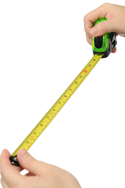 istock Isolated hand measuring by tape measure 141573259