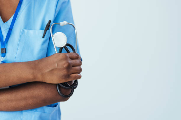 istock Female doctor holding a stethoscope in her hand 1415733441