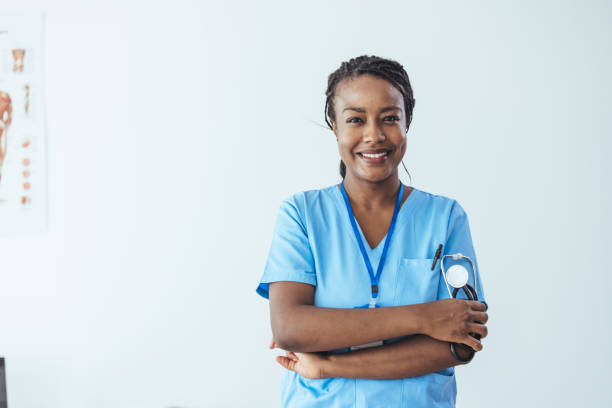 Portrait Of Female Nurse Wearing Scrubs Standing stock photo