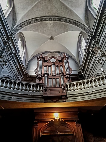 Church Saint-Maurice de Besançon is a 18.th century baroque church. The image shows the beautiful organ pipe and the vault of the main nave.