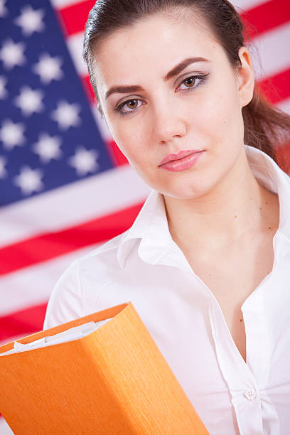 woman with folder over american flag