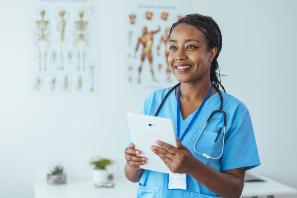 istock Young medical practitioner using a digital tablet in a hospital 1415737671