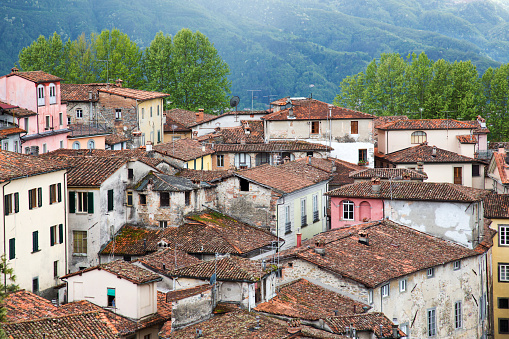 Barga, Italy - April 30, 2018: Rooftops in the old Tuscan town of Barga in the Gafagnana, Italian travel photography.