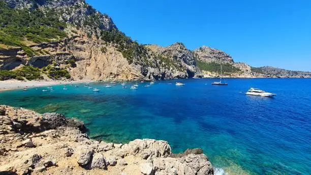 Beautiful natural beach Coll Baix (Platja des Coll Baix), Alcudia, Mallorca (Majorca). Amazing view of the turquoise clear sea of Mallorca.