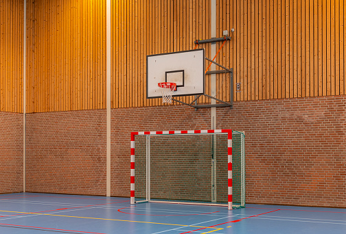 An empty school gymnasium, low angle view.