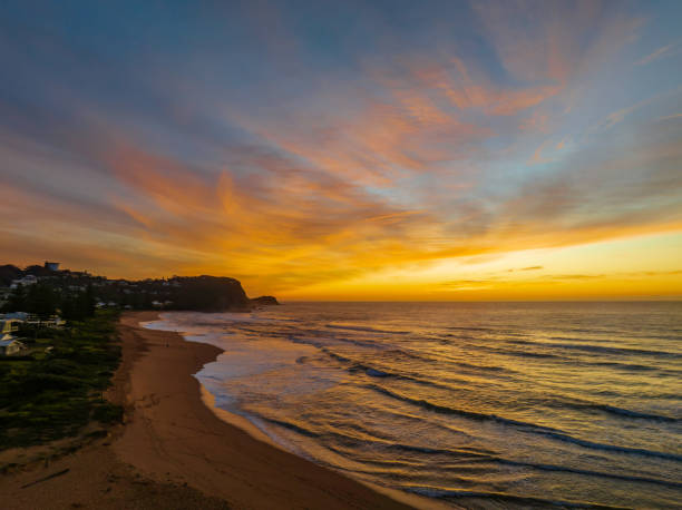 istock Sunrise and high cloud cover over the sea 1415750059