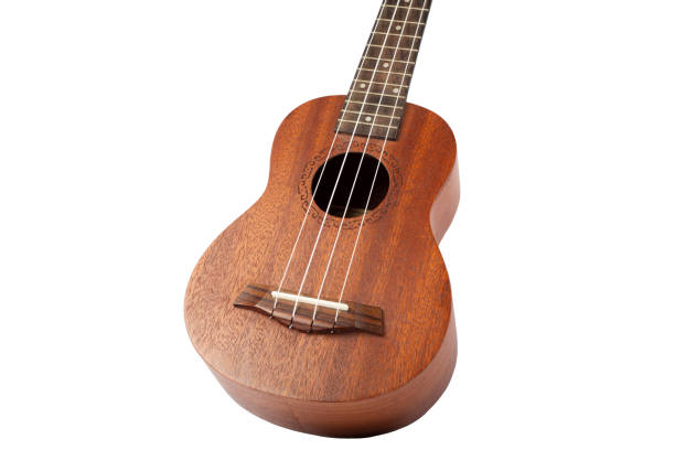 istock Wooden ukulele guitar isolated over white background. 1415750255