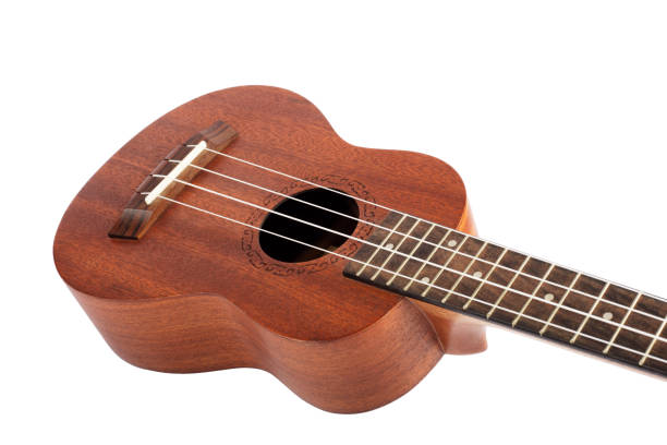 istock Wooden ukulele guitar isolated over white background. 1415750256