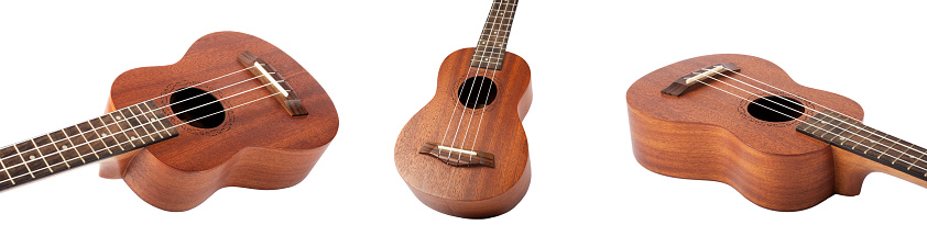Set of Wooden ukulele guitar isolated over white background