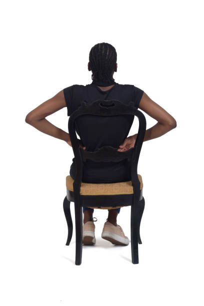 istock woman sitting on chair on white background 1415752952