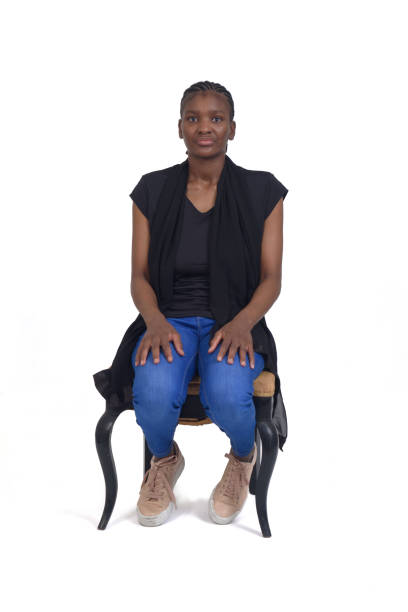 istock woman sitting on chair on white background 1415753101