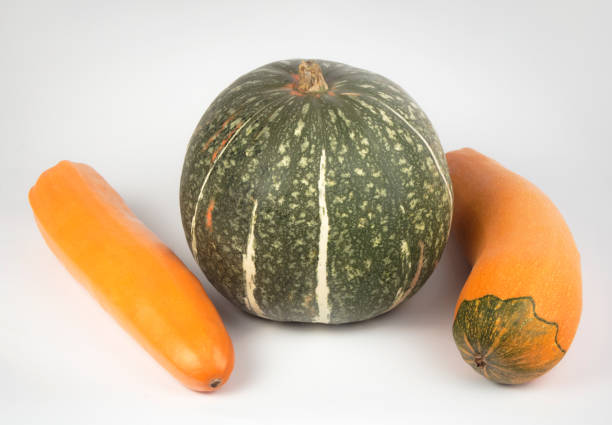 green pumpkin and yellow zucchini on a white background.