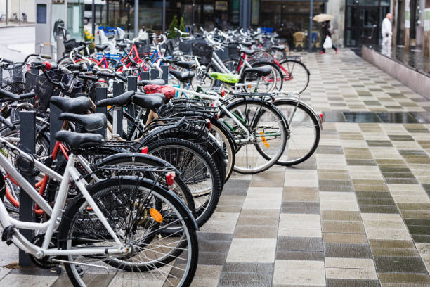 istock bikes parked on street in rainy weather 1415757295