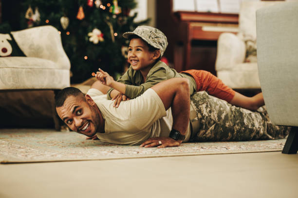 istock Father and son having fun together at Christmas 1415757513