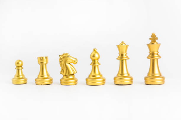 istock chess game gold isolated on white background. 1415758079
