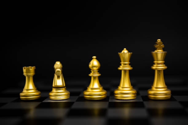 istock Chess game gold and silver on black background. 1415758087
