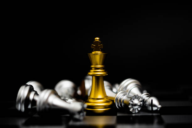 Chess game gold and silver on black background. stock photo