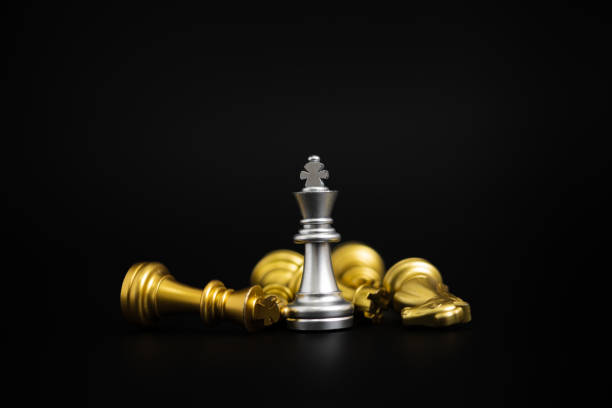 istock Chess game gold and silver on black background. 1415758093