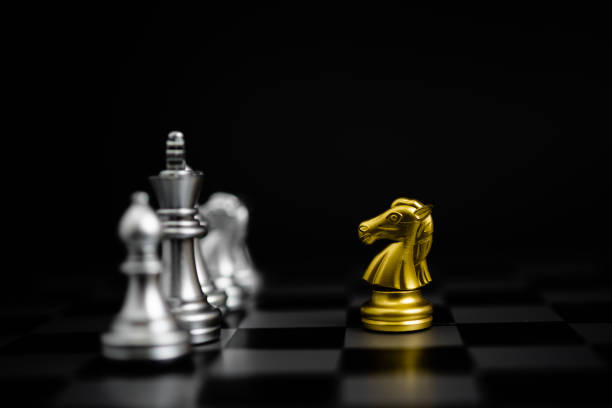 istock Chess game gold and silver on black background. 1415758120