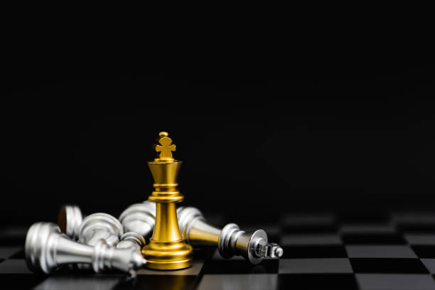 istock Chess game gold and silver on black background. 1415758132