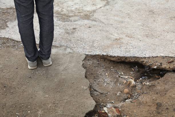 Broken pavement dangerous sidewalk Broken pavement - dangerous sidewalk hole in Casablanca, Morocco. Hazardous holes and damaged concrete. casablanca stock pictures, royalty-free photos & images